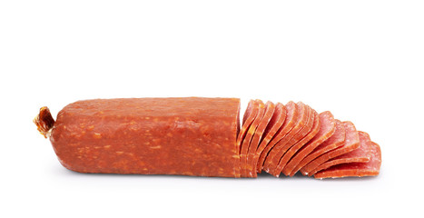 Smoked salami sliced on a white background