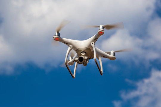 Quadcopter in flight against a blue sky. Drone.