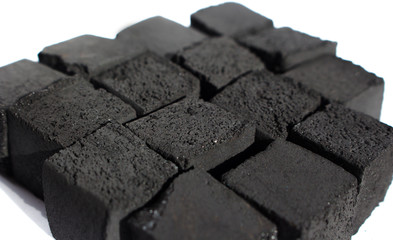 Coconut coals for hookah on a white background