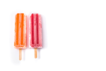 Orange and strawberry popsicles isolated on white background.. Top view. Copyspace