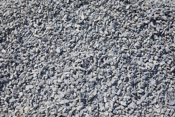 Background and texture of gray granite rubble. Breakstone, rubble stones