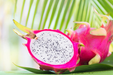 Fresh, tasty tropic, exotic dragon pitahya dragon fruit near palms