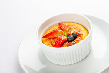 Baked cottage cheese dessert with strawberry on white background