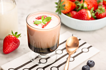 Healthy strawberry smoothie in glass