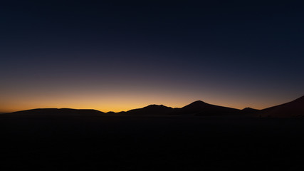 Sossusvlei Desert, Namibia, sunrise behind the dunes 