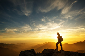 Fototapeta premium Hiker meets the sunset on the Moro rock in Sequoia national park, California, USA.