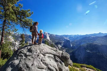 Fototapeten Mother with  son visit Yosemite national park in California © Maygutyak