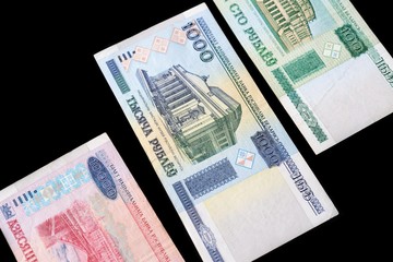 Outdated Belarusian rubles isolated on black close up