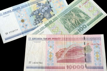 Outdated Belarusian rubles isolated on black close up