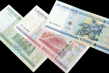 Outdated Belarusian rubles isolated on black close up
