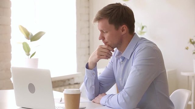 Stressed impatient businessman checking time waiting too long in office
