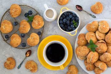 Italian healthy breakfast: homemade cookies - biscotti -  made from  ricotta, fresh blueberries,  barley coffee, coconut milk