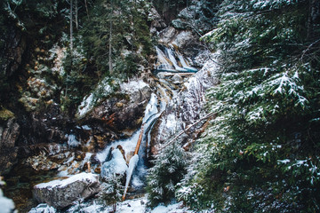 Winter spring fed creek waterfalls in the winter