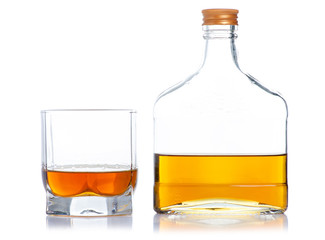 Glass with cognac and bottle cognac on a white background. Isolation