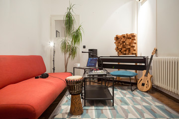 Home music studio equipped with various instruments.