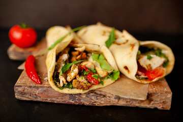 delicious mexican tacos with salad on concrete background. mexican cuisine