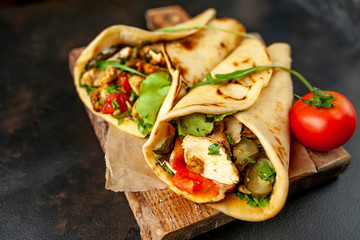 delicious mexican tacos with salad on concrete background. mexican cuisine