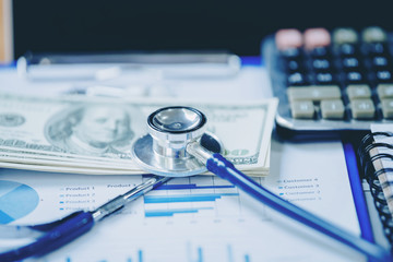 heap of dollars with stethoscope