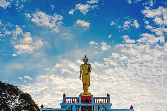 Standing Buddha image And the blue sky, religious concepts