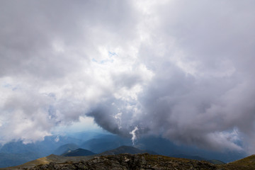 Beautiful cloudy landscape in the Alps, in summer