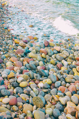 Colored stones in the beach water