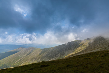 Beautiful cloudy landscape in the Alps, in summer