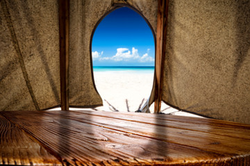 Desk of free space and summer background of tent 