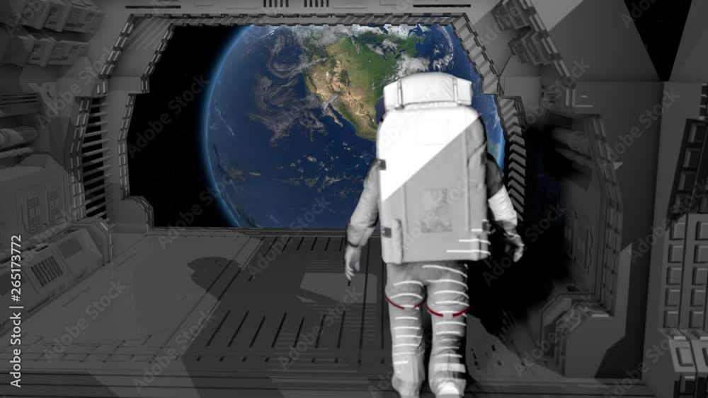 Wall mural alone astronaut walking in a futuristic sci fi corridor admiring the view of the earth. elements of 