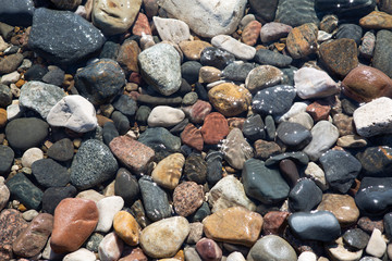 a small pebble under river water