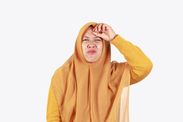 Shocked, stressful , tired and frustrated face expression of Muslim asian woman wearing hijab isolated over white background