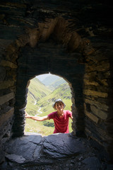 Woman looking in fortress window