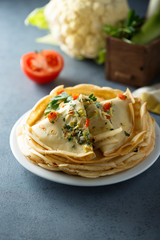Savory pancakes with tomato, leek and herbs