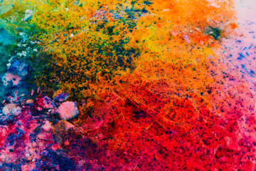 Background of colorful Holi powder on the snow