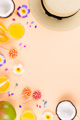 Summer tropical fruits frame on coral color background