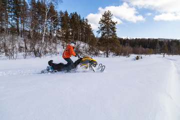 Athlete on a snowmobile.