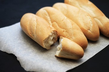 french baguettes, loaves on a dark background