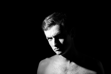 dramatic black and white photo, male portrait, aggressive face