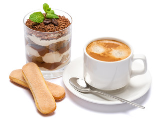 Classic tiramisu dessert in a glass and cup of coffee isolated on a white background with clipping path