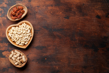 Various nuts selection on wooden table