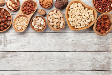 Various nuts selection on wooden table