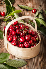 Sweet cherries in a wooden basket.