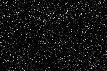 Obraz premium Chaotic white bokeh on a black background, light spots texture, abstraction, falling snow, star sky, bright glare of light texture