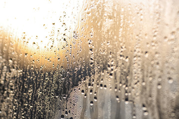 texture of water on the glass. Background of condensate or rain on the window. Selective focus