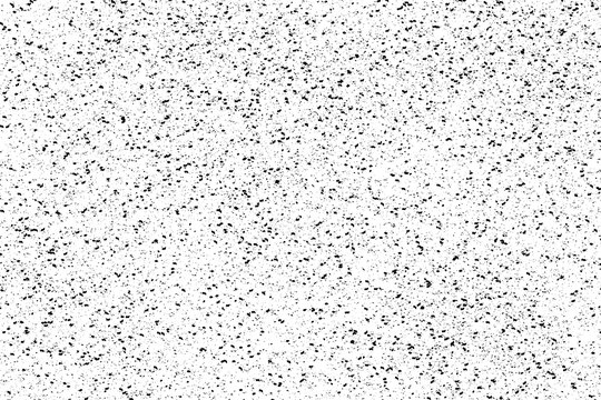 Drops of black paint splattered on a white background, texture