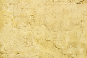 light yellow textured plaster on the wall