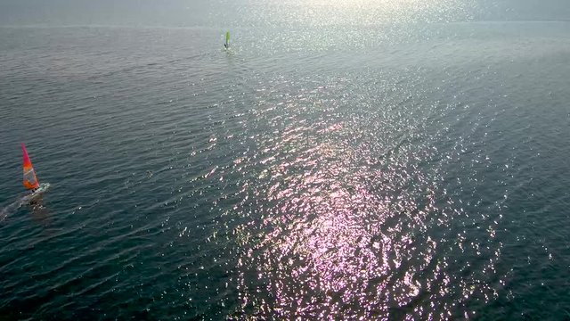 Aerial view of windsurfers, in the area of Epanomi Thessaloniki  Greece, circular movement by drone