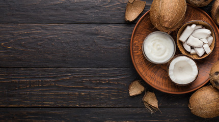 Coconut products over wooden background