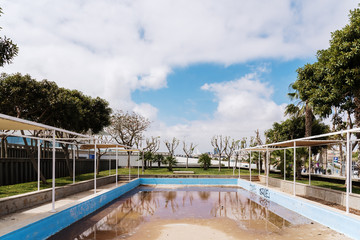 Valencia, Spain - April 29, 2019: Outdoor swimming pool abandoned and dirty.