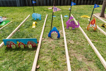 Fototapeta premium Valencia, Spain - April 29, 2019: Portable mini-golf placed on the lawn for children's fun.