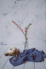 Delicate shu cake with cream on a white wooden background
